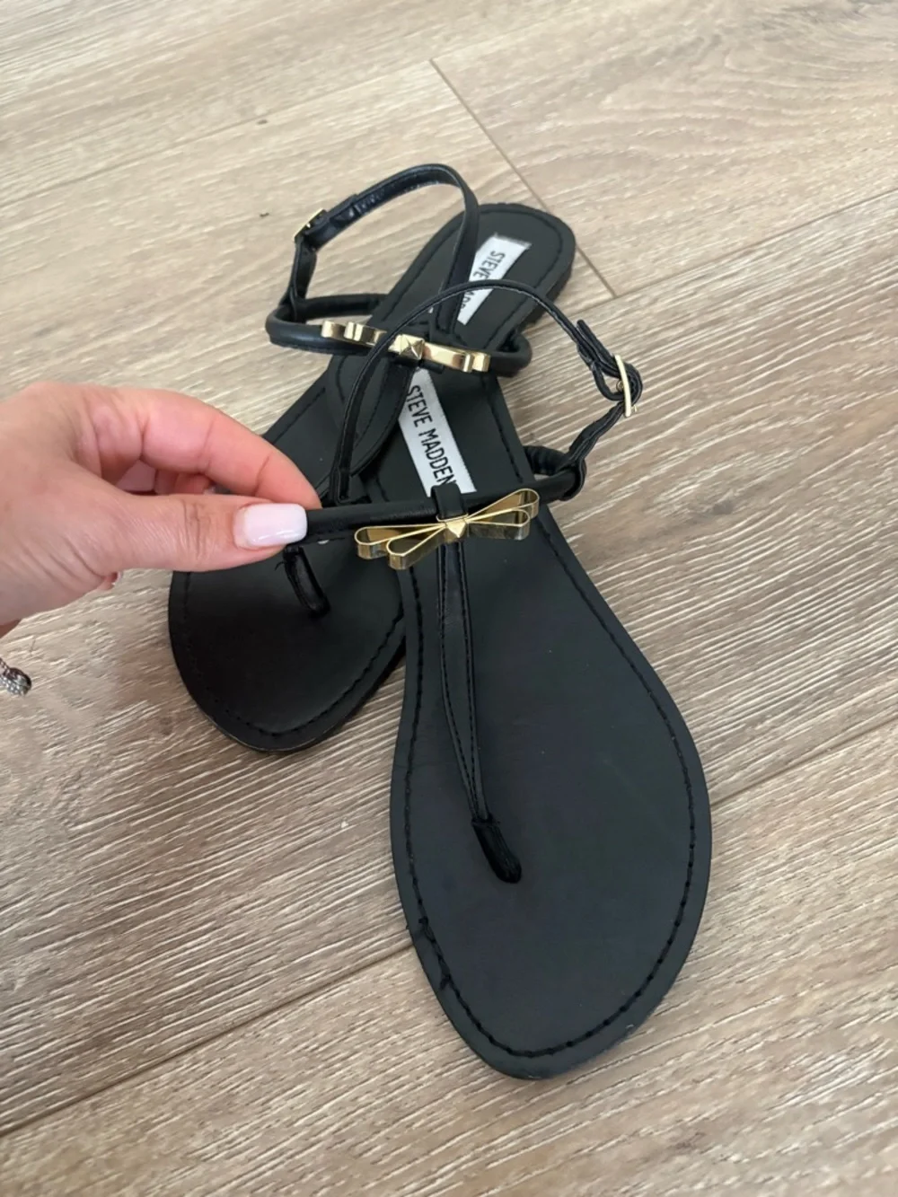 Steve Madden Black T-Strap Sandals with Gold Bow Accent